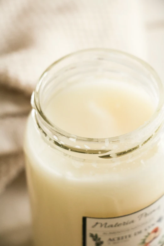 a glass jar filled with lots of milk