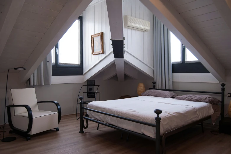 the bedroom has been made by an attic