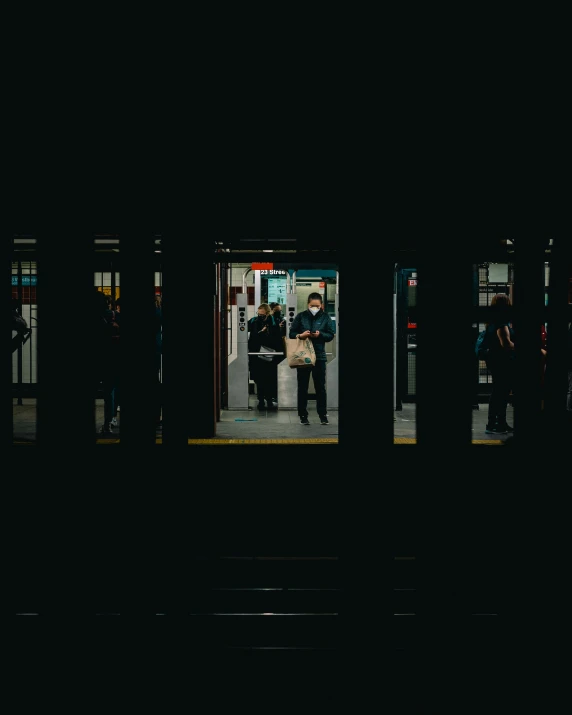 a group of people in a subway terminal