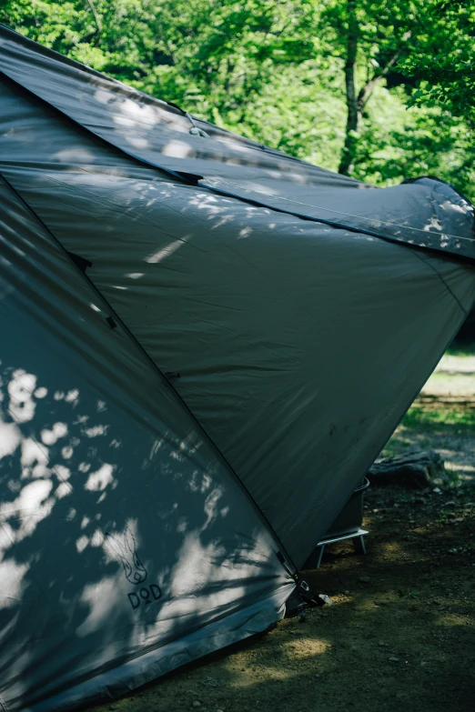 a tent in the sun outside its setting