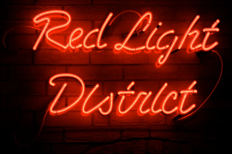a red light district sign with red lights shining