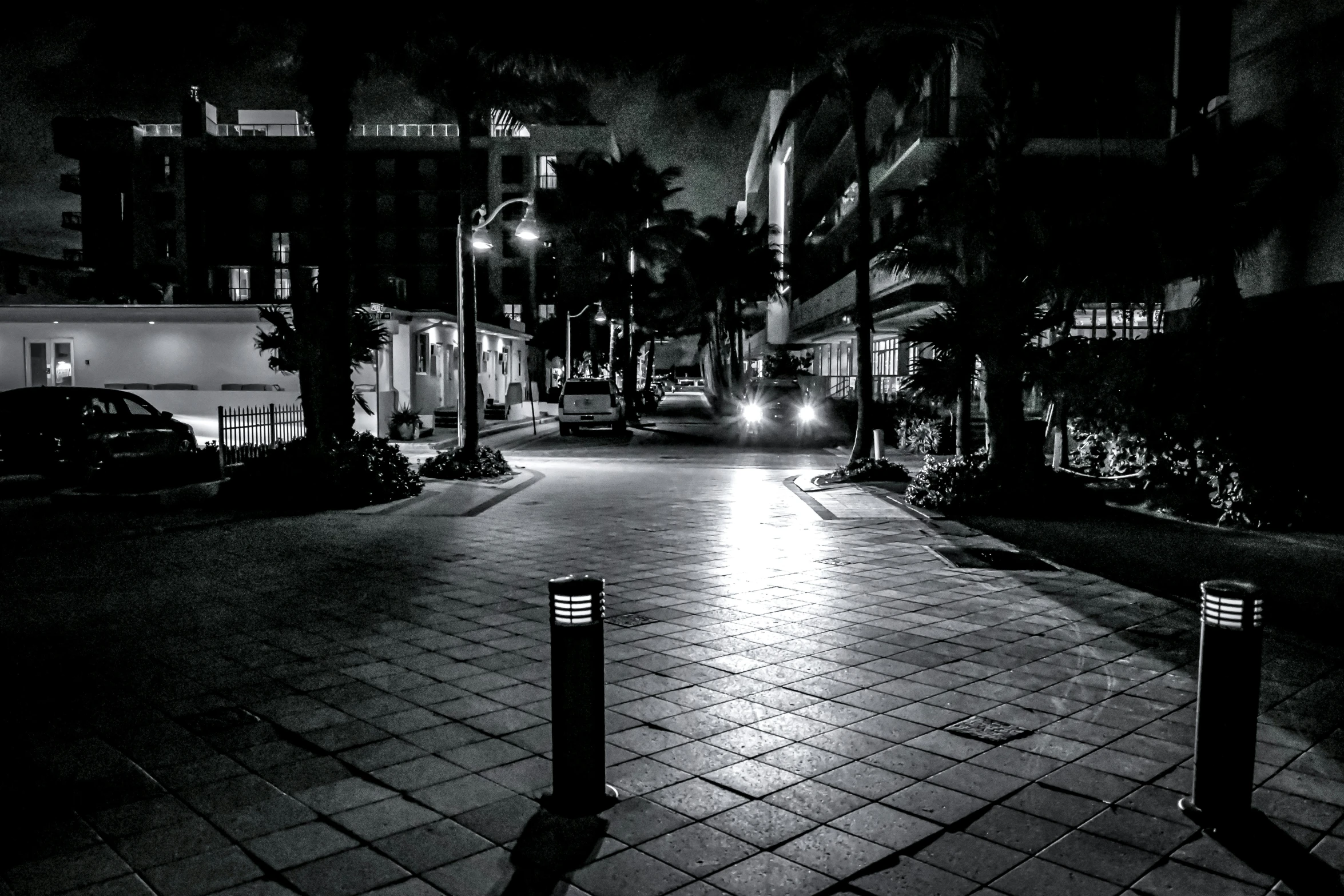 this is a black and white po of a city street at night