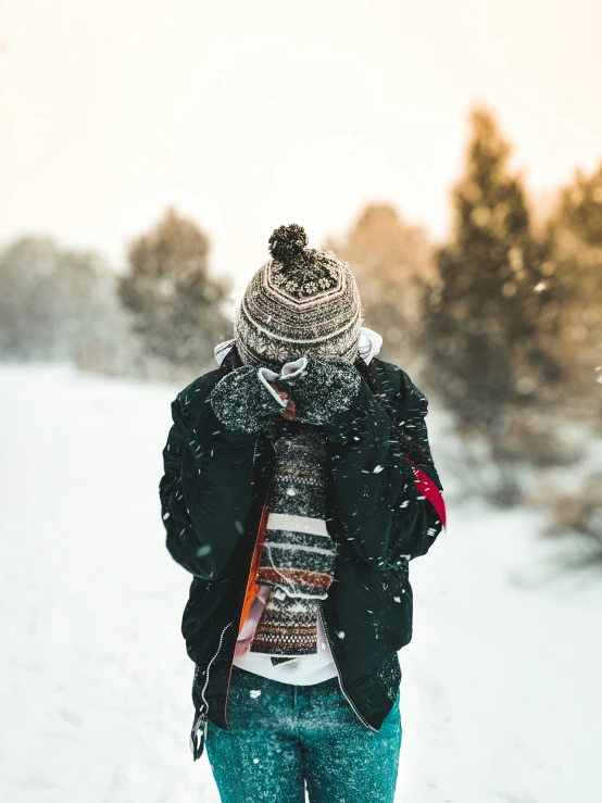 a person that is walking in the snow