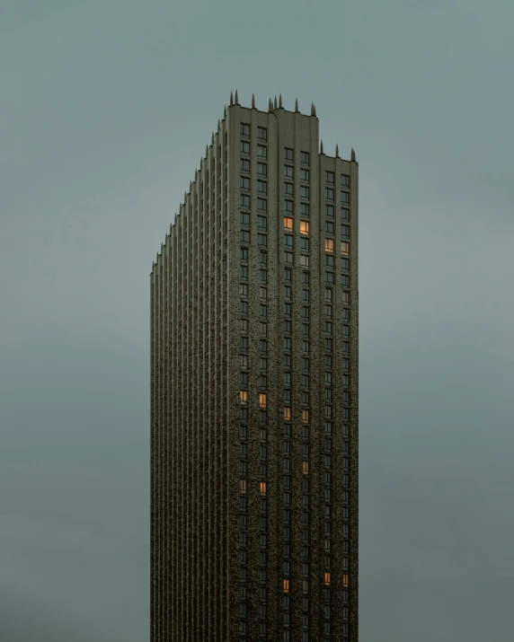 large building with several windows that are lit up