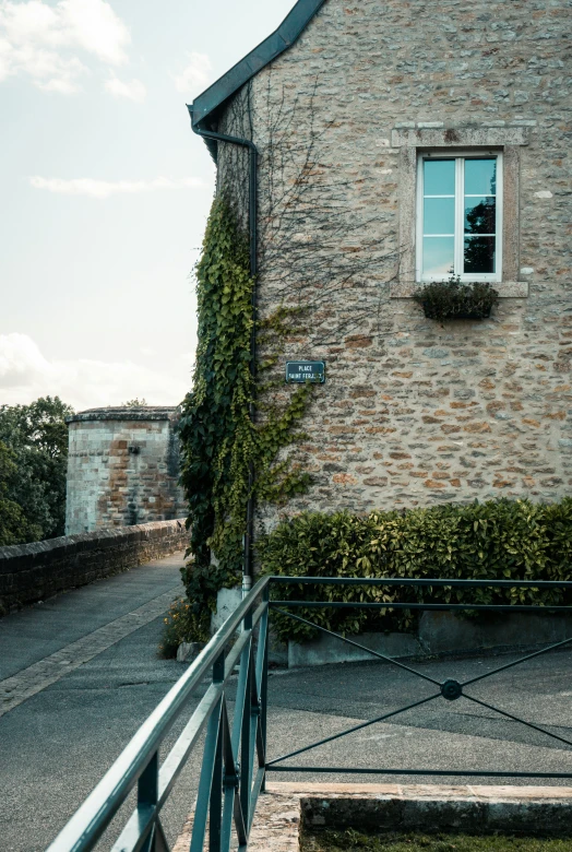 there is a very small brick building with a clock on it