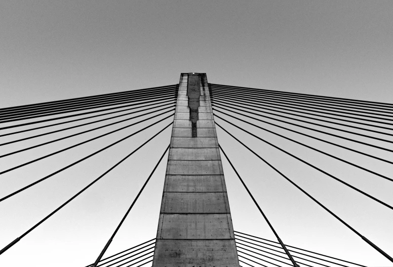 black and white pograph of an upward view of a bridge