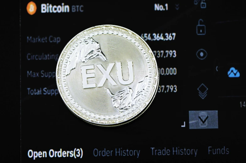 a silver coin with the words exc on it is shown