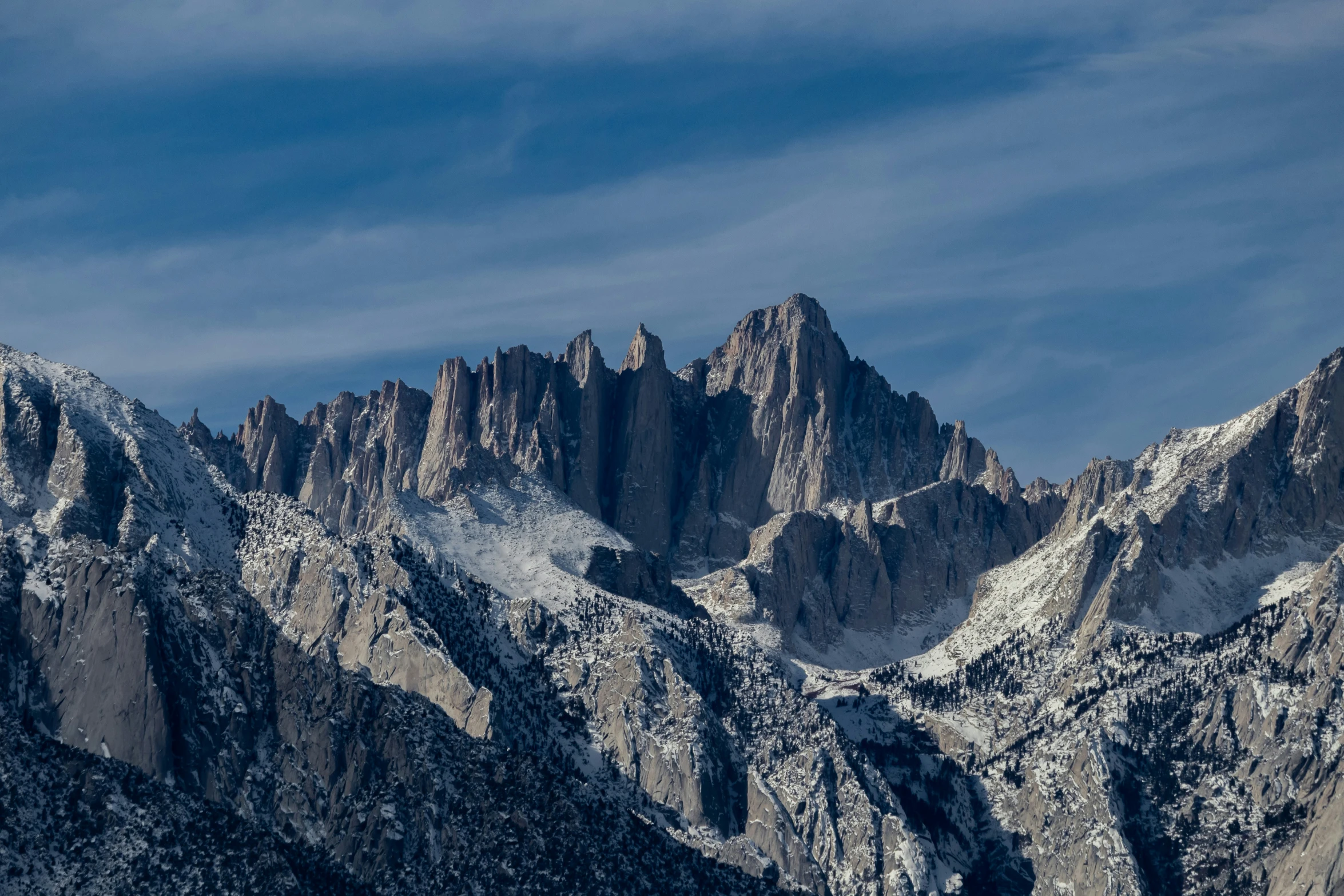 a majestic mountain that is covered in snow