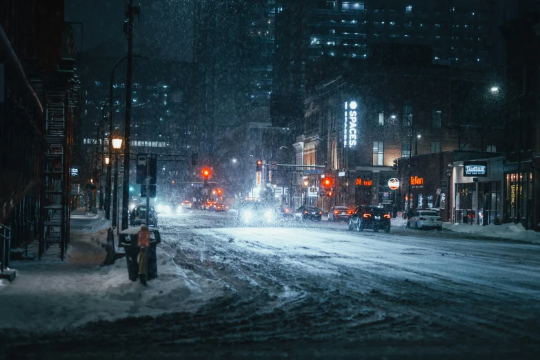 the night scene of a city with lots of snow
