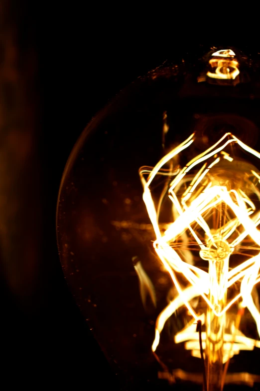 a close up of a light bulb on a dark background