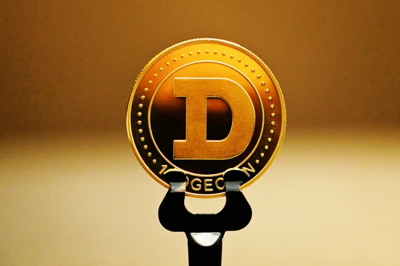 a golden d badge sitting on a pole