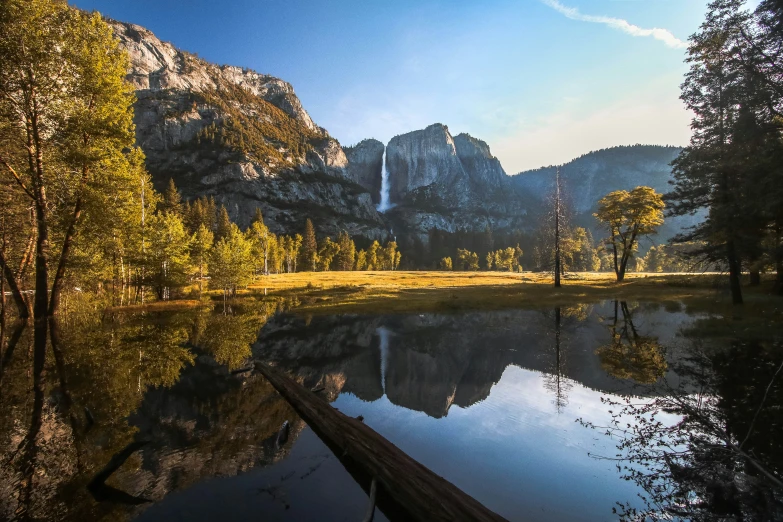 a mountain lake surrounded by some pine trees