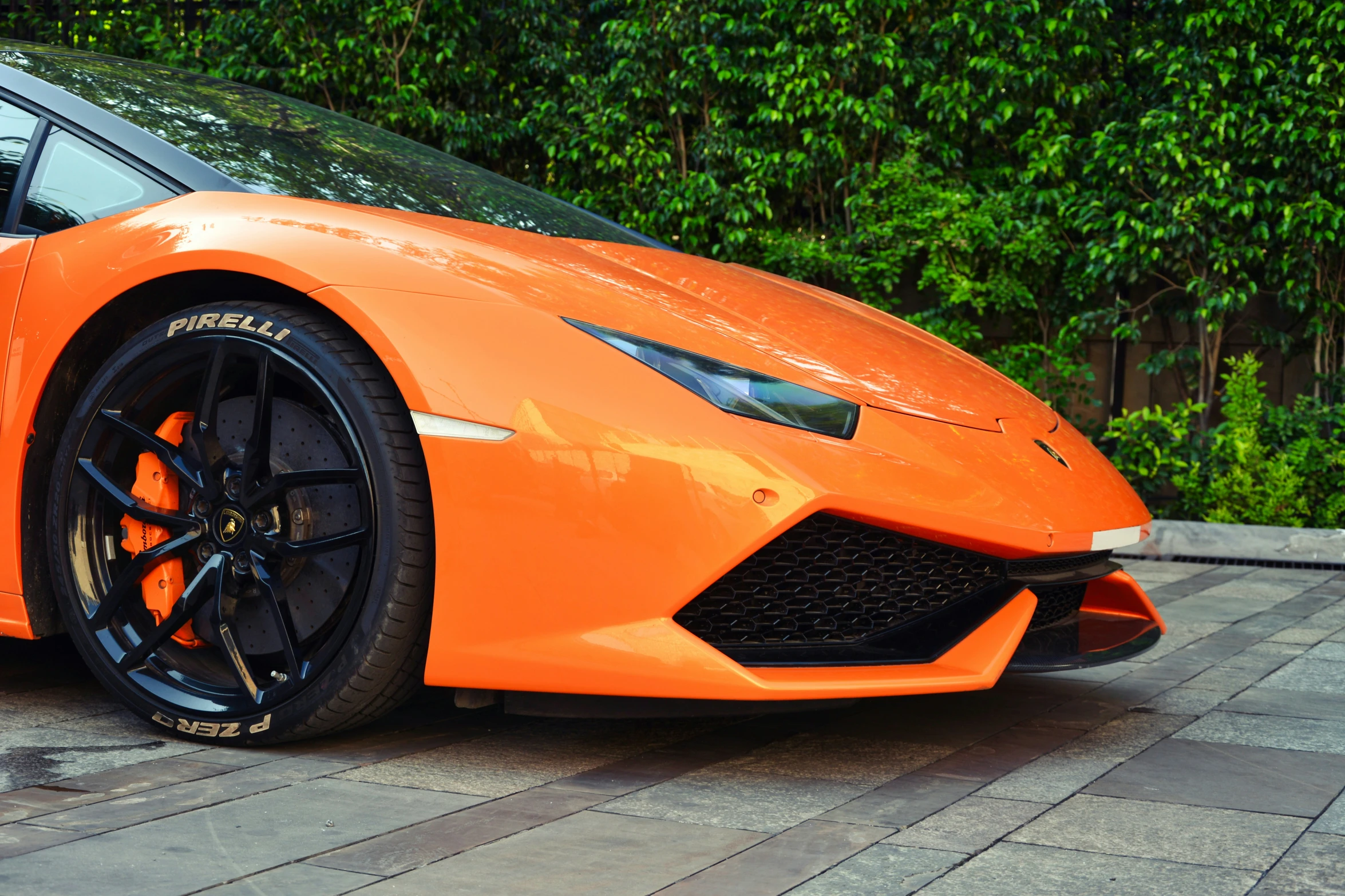 a close up view of an orange sports car