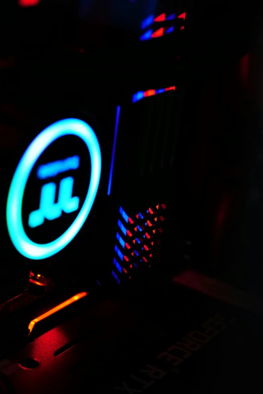 a laptop that is lit up with a neon light