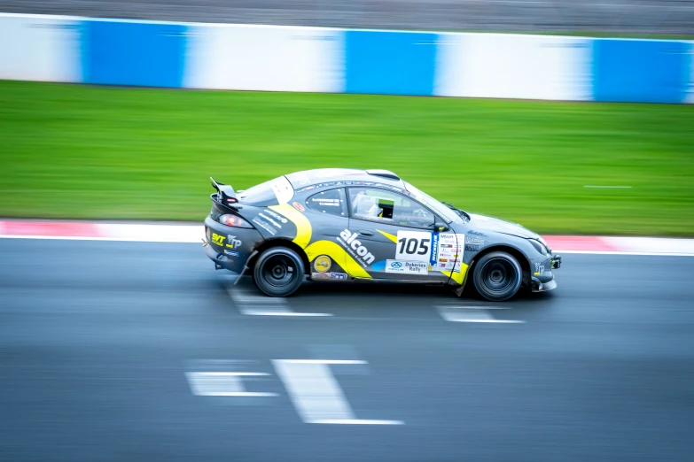 an image of a racing car on the track