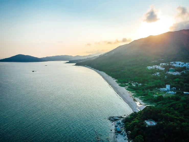 aerial view of sunset over ocean with several boats