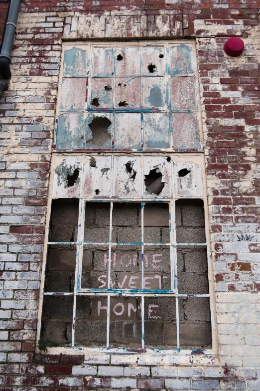 the building's window has holes in it