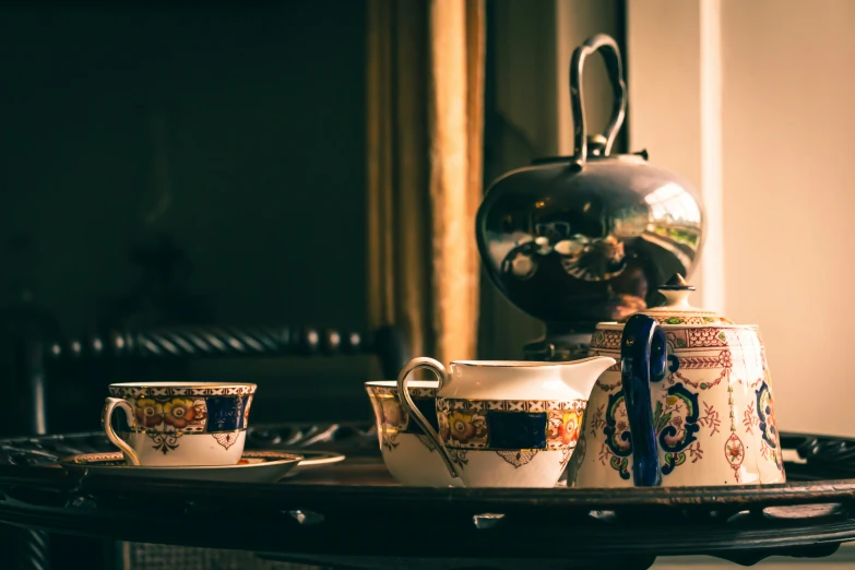 two cups and a saucer on a tray