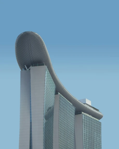 large modern office building with curved roof and sky