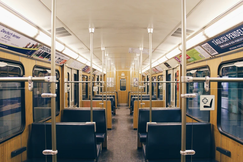 a subway car with several seats and the doors