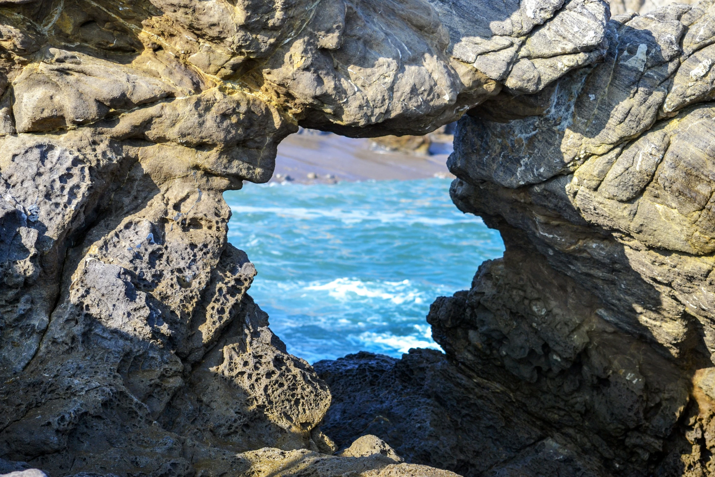 a large, rock structure in the middle of the ocean