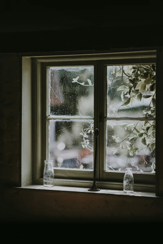 there is a rainy window with some water outside