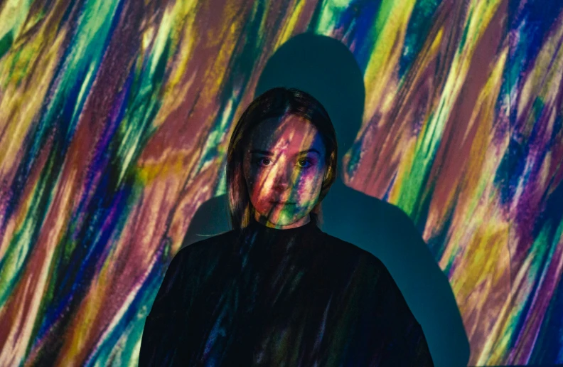 a man wearing black shirt and tie dye