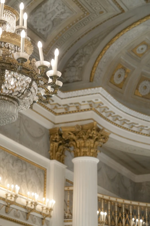 several chandeliers hang from a ceiling in a building