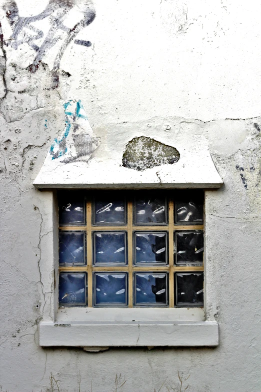 a window on a wall with an open rectangular window