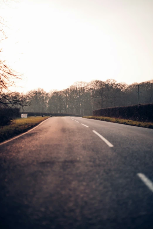 a person riding on an empty open road