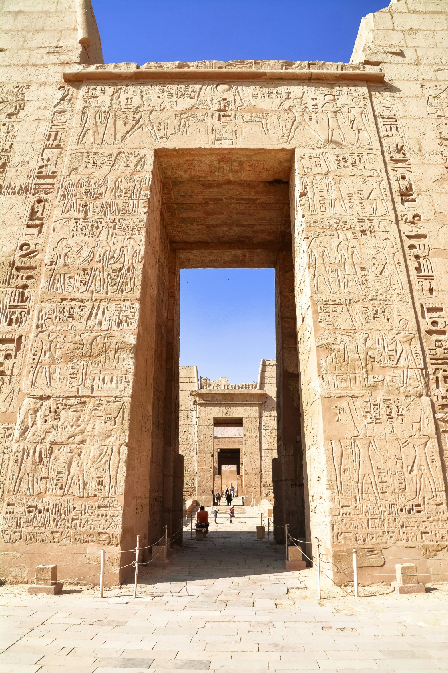 two large archways and carvings at the entrance to a temple