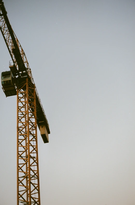 a tall crane that is on top of a building