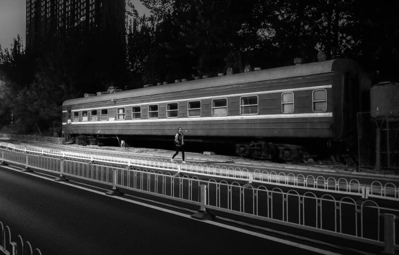 black and white image of the side of an old train