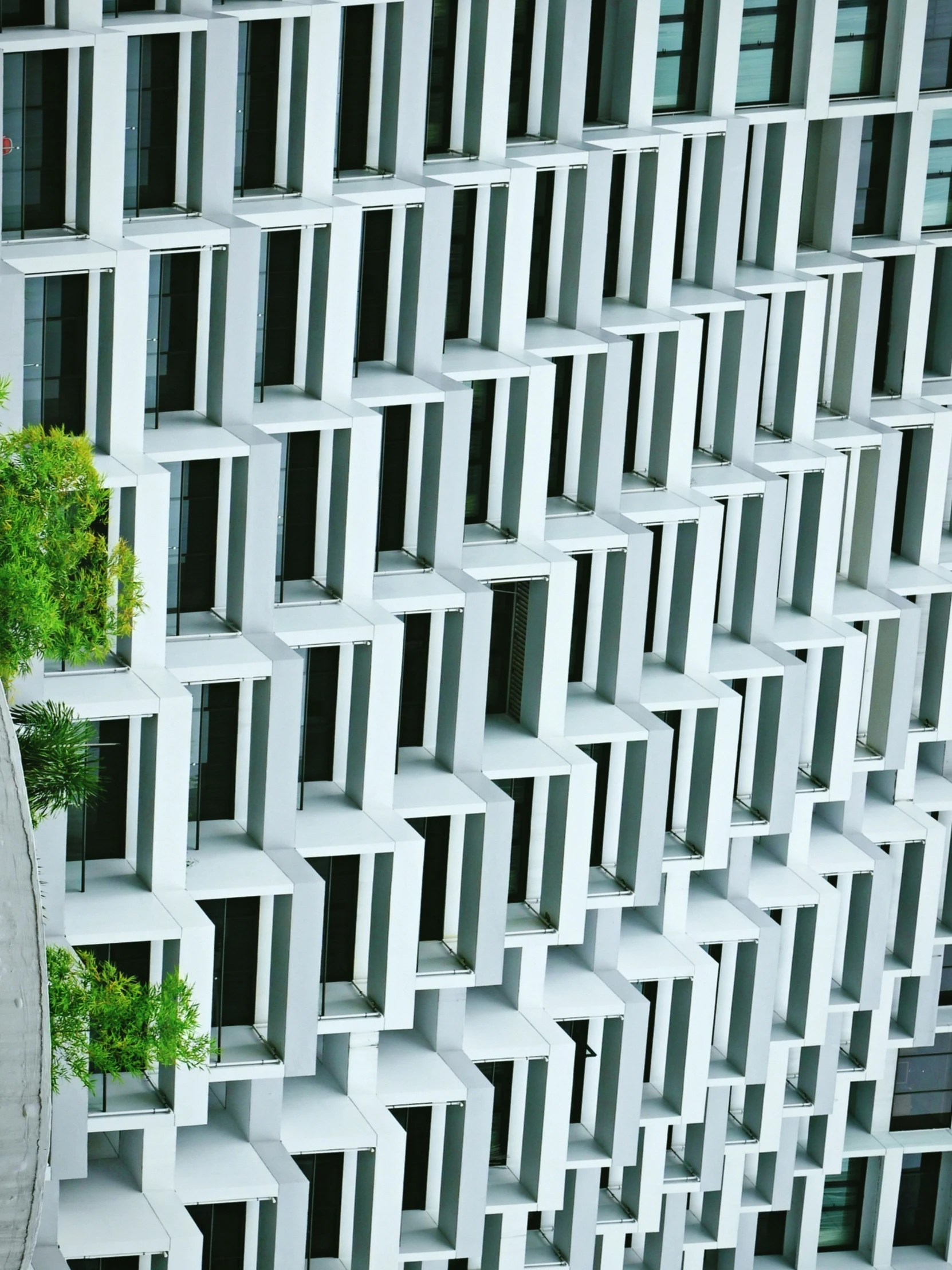 a very modern, white building with a vertical window