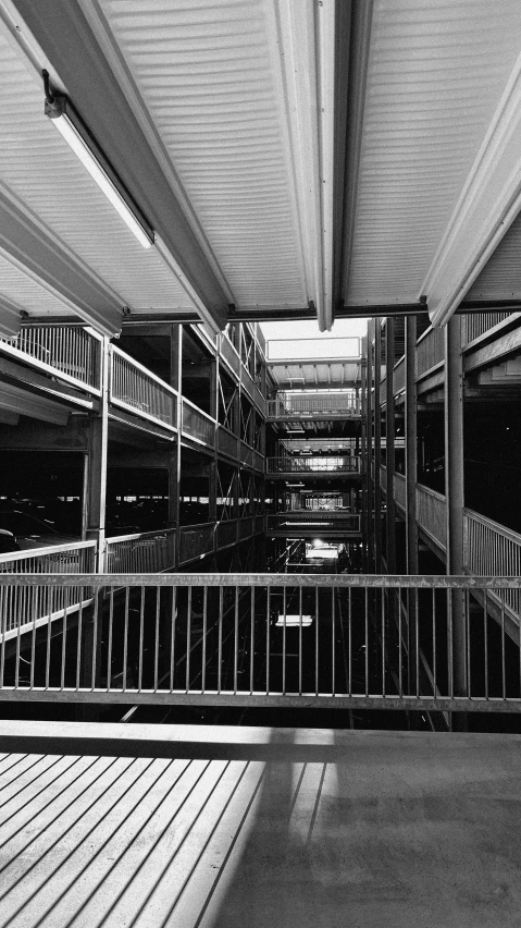 black and white image of a hallway inside of a building