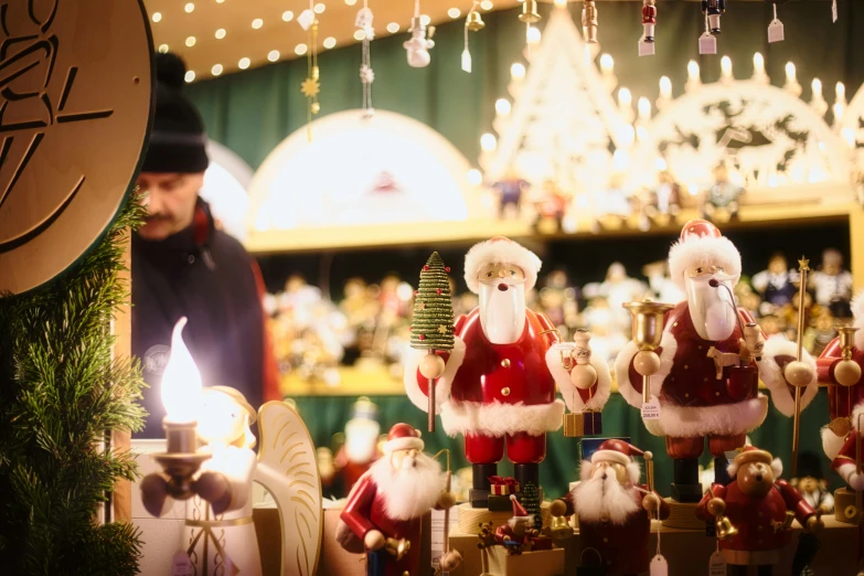 there is an assortment of different santa figurines and lights