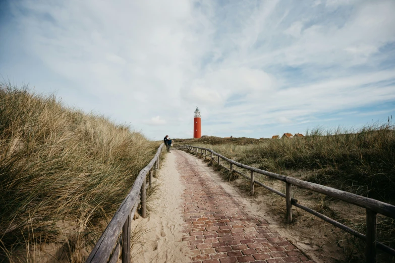 a path leading into a red light house