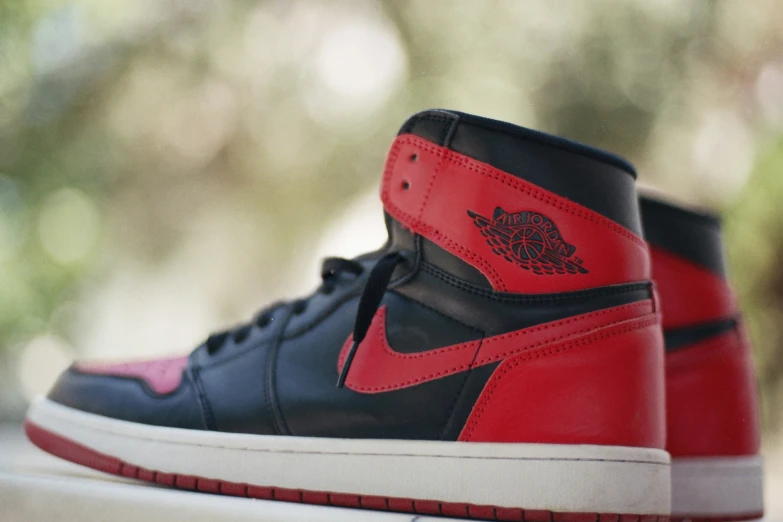 an on feet view of the air jordan shoe in black, red and white