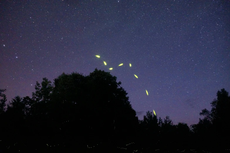 many lights are glowing brightly on the night sky