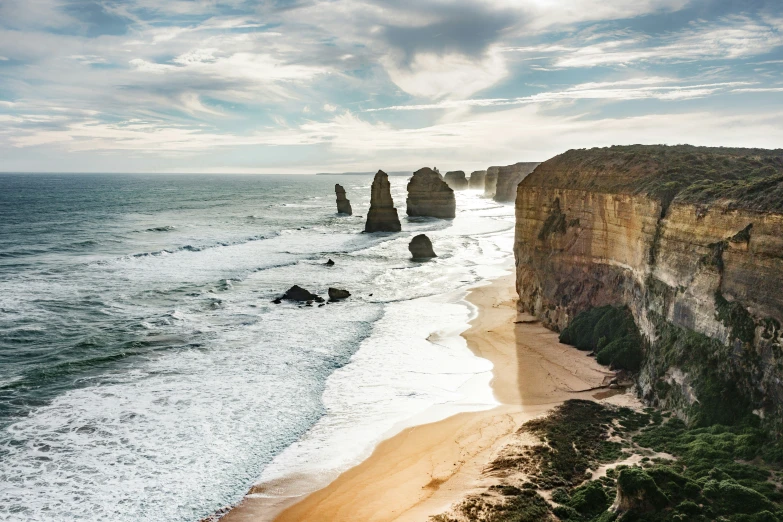 the ocean is beautiful with two big rocky towers