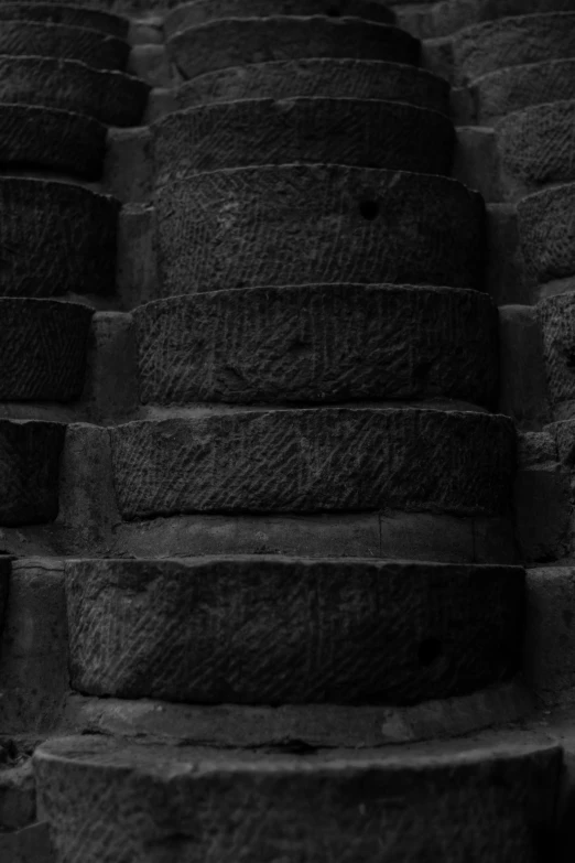 several large tires sitting on top of stone steps