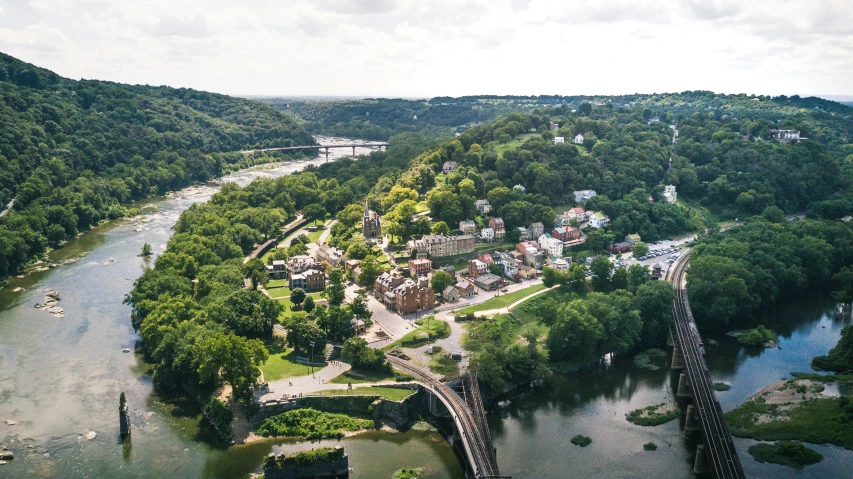 a bird's eye view of a small town and river
