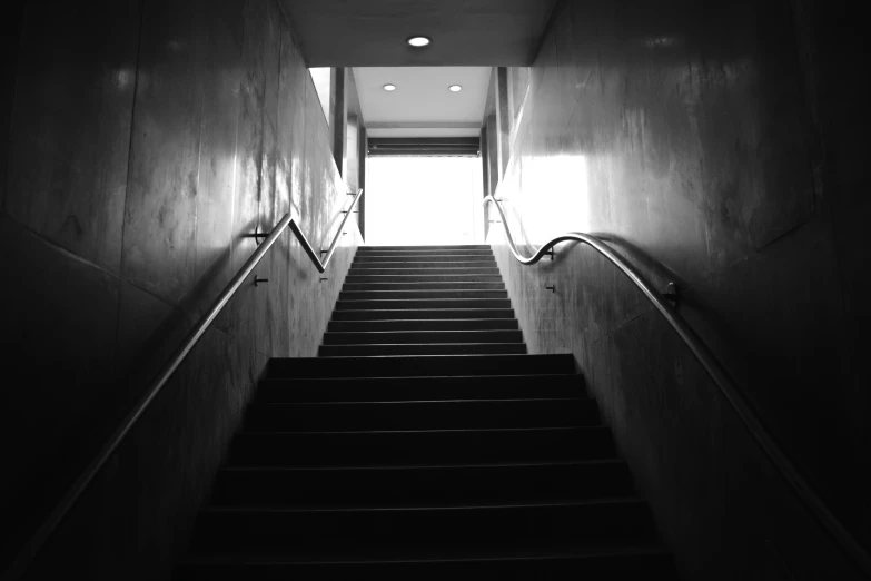 the stairs in a building have lights on them