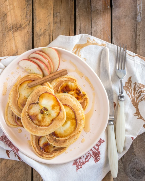 pancakes with apples and cinnamon on a plate