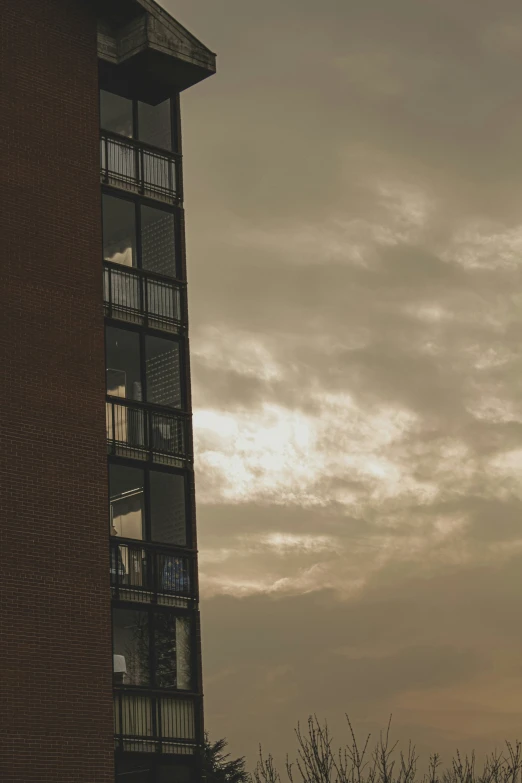 a large clock sits next to a tall building