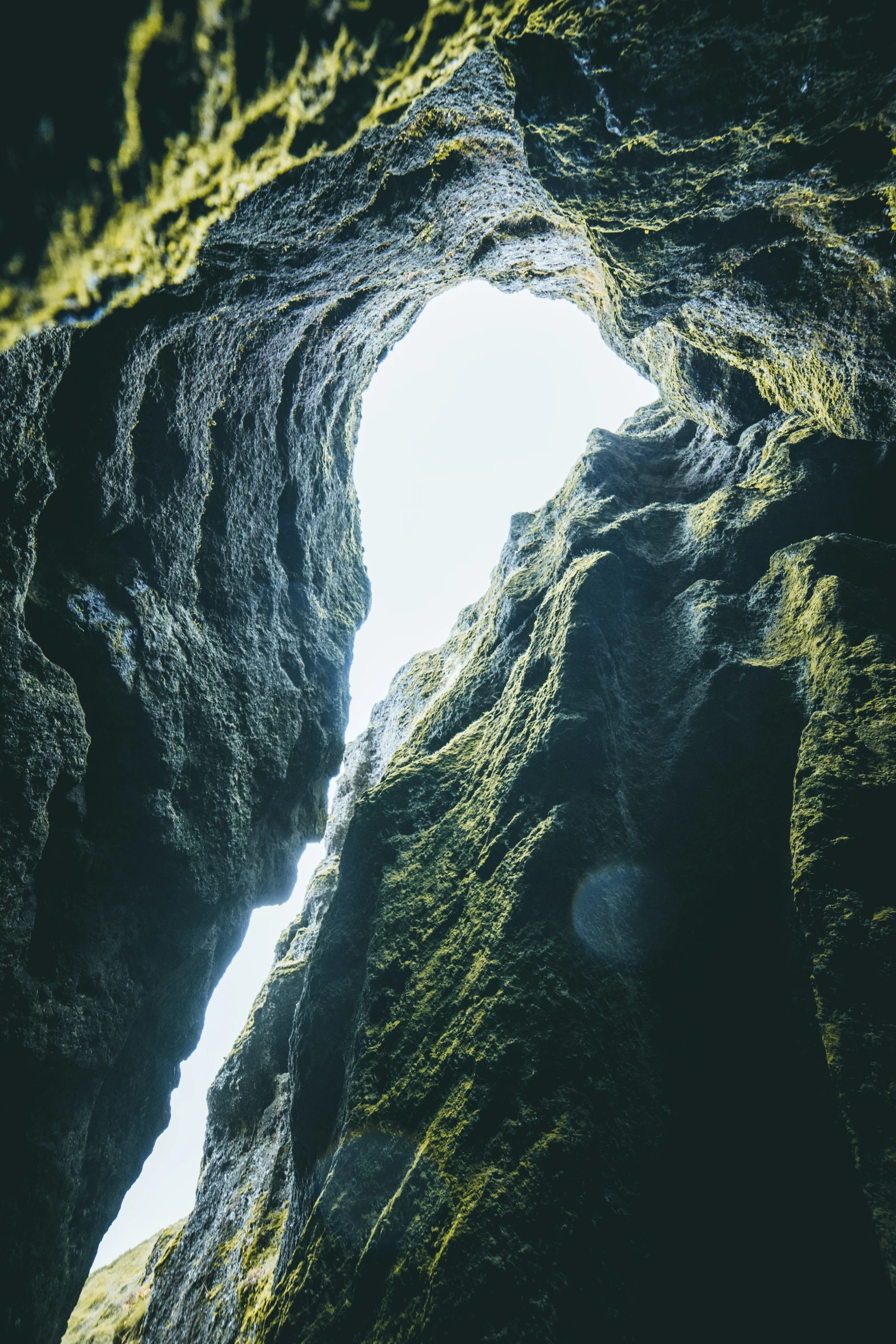 the water's edge is dark, but looks like a tunnel