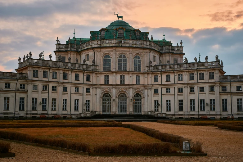 a large building that is in the middle of a field