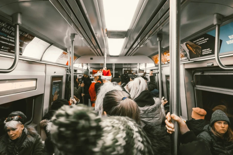 people riding a bus during winter and wearing hats