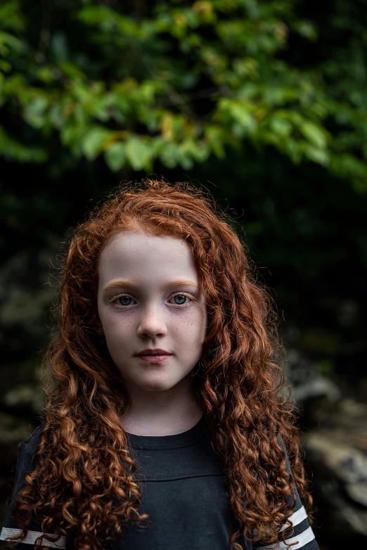 a young woman with curly red hair