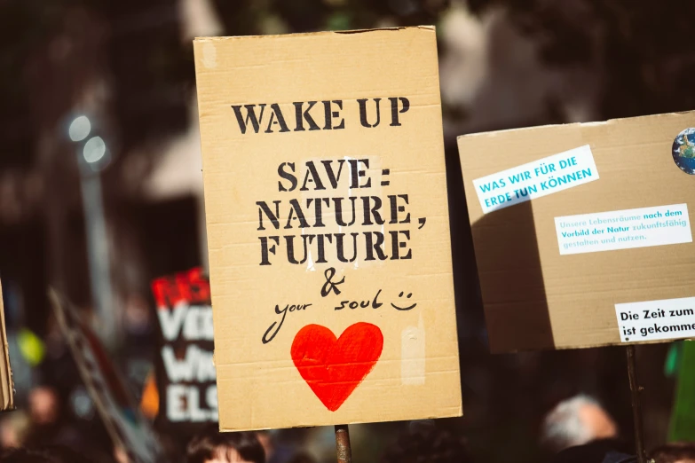 protest signs that are being held at a climate rally